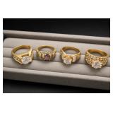 Four Gold-Tone Fashion Rings, Clear/Purple Stones