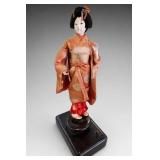 Japanese Geisha Doll on Wood Base
