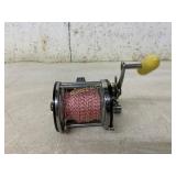 Vintage-Style Fishing Reel with Yellow Handle