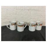 Four Holiday-Themed Ceramic Mugs Four Holiday-Themed Ceramic Mugs