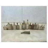 18 Glass Bottles of Various Sizes