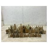54 Glass Bottles of Varying Sizes