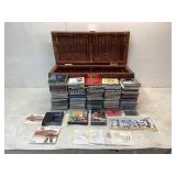 CDs, Manuals, DVDs, and Wicker Storage Chest