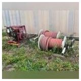 Two fire hose reels with hoses and pump