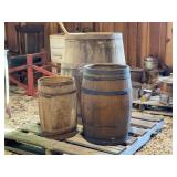 Group of Wooden Barrels and Cane Fishing Poles