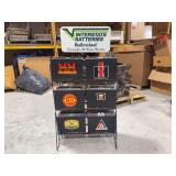 Original metal Interstate Batteries advertising rack with “Built to last! Serving You All Across America”
