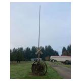 Wheels, Railroad Crossing Sign, and Flag Pole