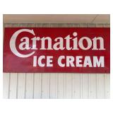 Carnation Ice Cream Embossed Tin Sign