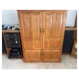 Entertainment Center with TV, photo printer and items in cabinet