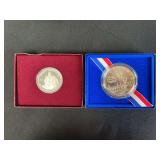Two US Commemorative Silver Half Dollars: 1982 & 1986