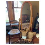 Accent Furniture Assortment: Chair, Mirror, Basket, Pillows, and Headboard Decor