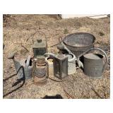 Assorted Metal Garden Decor: Watering Cans, Lanterns, and Wash Tub