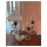 Group of Four Clear Glass Oil Lamps