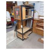 Metal shelf with first aid kit