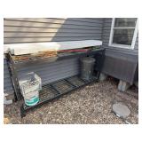 90 inch wide metal rack with vinyl sleeves and an exterior storage bin