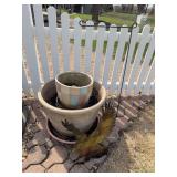 Planters and yard art. The large pot is 22 inches wide.