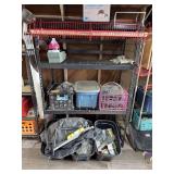 Metal shelf with bins and everything else on it