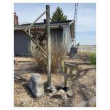 98 inch tall yard sculpture with two concrete eagle heads and a fake rock