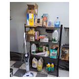Storage Rack with Cleaning supplies and Bissell Vac.