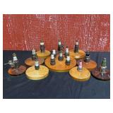 Vintage Spark Plug Display Collection on Wooden Bases