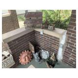 Assorted Decorative Items including Birdhouses, Angel Statue, and Terra Cotta Sun