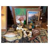 Assorted Decorative Items Including Paintings, Wood Carvings, and Figurines