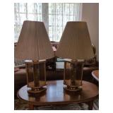 Two old-fashioned glass, wood, and brass lamps