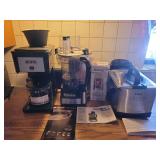 Collection of Kitchen Appliances: Bunn Coffee Maker, Hamilton Beach Food Processor, T-fal Deep Fryer, and Bionic Blade Blender