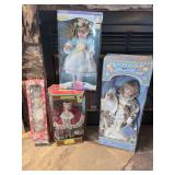 Collection of Four Decorative Porcelain Dolls in Original Packaging
