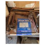 Plumb shop drain tape and pipe wrenches