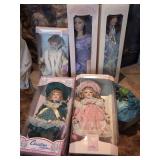 Collection of Five Hand-Crafted Porcelain Dolls in Original Packaging