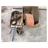 Assorted Collection of Belts, Pulleys, and Metal Parts