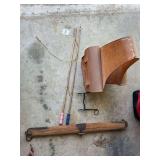 Equestrian Tack Collection: Leather Saddle Bag, Metal Bit, Whips, and Wooden Spreader Bar