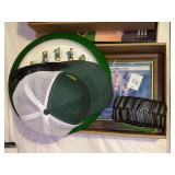 John Deere Collectible Assortment: Wall Clock, Framed Print, Tire Desk Accessory, and Two Caps