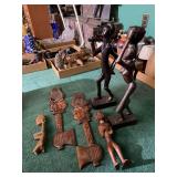 Collection of Carved Wooden Figurines and Decorative Wall Hangings