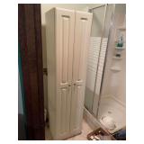 Tall White Bathroom Storage Cabinet with Assorted Household Items