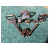 Collection of Household Items Including Irons, Lighters, and Tool