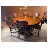 Round Oak Dining Table with Six Chairs and Lion Paw Feet
