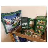 John Deere Collectible Assortment Including Metal Storage Box, Diecast Tractors, and Decor