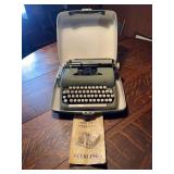 Smith-Corona Sterling Portable Typewriter with Carrying Case and Manual