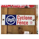 USS Cyclone Fence Sign