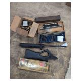 Assorted Firearms Maintenance Kits, Rifle Components, and Brass Casings