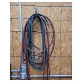 Assorted Rubber Hoses Hanging on Wall Hook