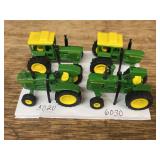 (4) 1/64 John Deere Tractors Ertl