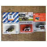 (3) Bobcat + New Holland Skid Loaders NIB