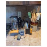 Kitchenware Assortment Including Cosori Electric Kettle, Smith's Knife Sharpener, Fiskars Sharpener, and Utensil Crock