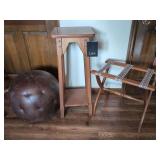 Lane Wooden Plant Stand, Folding Luggage Rack from The Cape Craft Collection, and Tufted Faux Leather Round Ottoman