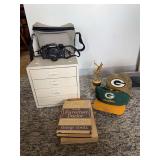 Mixed Lot of Electronics, Books, Sports Memorabilia, and Storage Cabinet