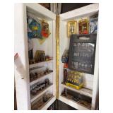 Wall-Mounted Wooden Storage Cabinet Filled with Woodworking Router Bits and Accessories