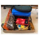Mixed Lot of Hunting, Fishing, and Outdoor Gear Including Knives, Sharpening Stones, and Trail Camera